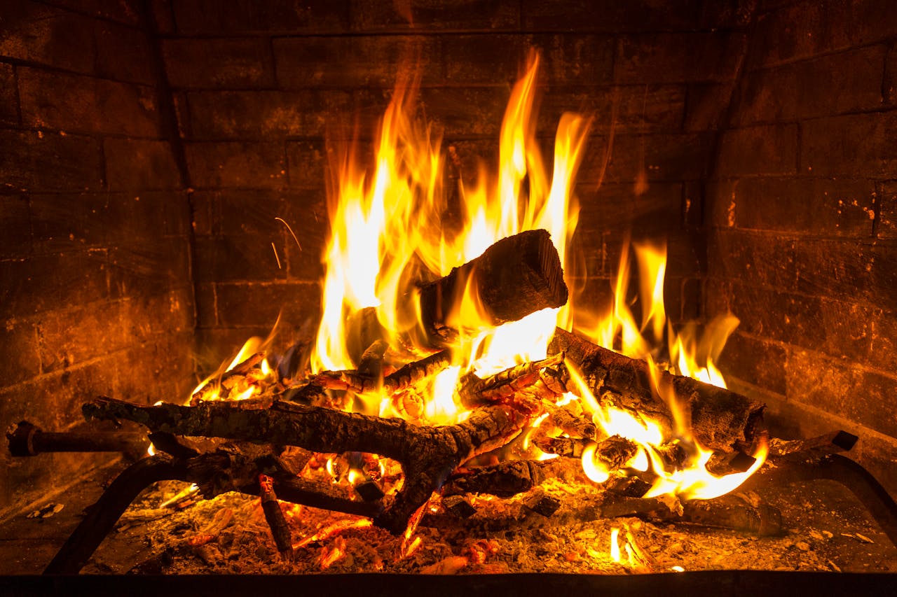 A close-up of a blazing fire in a cozy indoor fireplace in San Antonio, Texas.