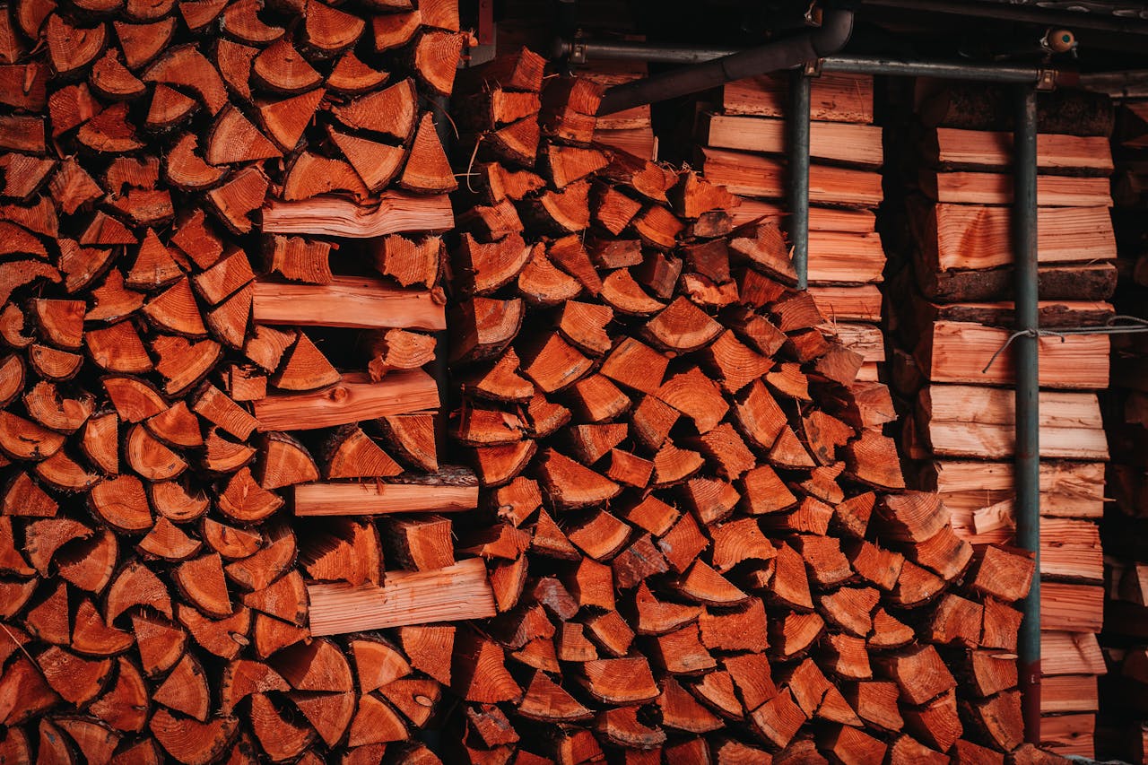 Neatly stacked firewood ready for use, perfect for energy efficient heating.